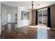 Bright living room featuring hardwood floors and sliding glass doors to the backyard at 6237 Glimmering Light Ave, Las Vegas, NV 89139