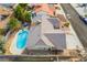 This aerial shot showcases a home with a pool, patio area, and desert landscaping, situated in a suburban neighborhood at 6320 Vicuna Dr, Las Vegas, NV 89146