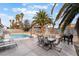 Expansive backyard with a swimming pool and comfortable seating area at 6320 Vicuna Dr, Las Vegas, NV 89146