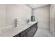 Bathroom featuring a modern vanity with vessel sinks, white countertop, and dark wood cabinets at 6320 Vicuna Dr, Las Vegas, NV 89146