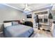 Bedroom with a stylish bed and a sliding glass door, creating a modern and inviting space at 6320 Vicuna Dr, Las Vegas, NV 89146