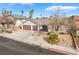 Charming single-story home featuring a two-car garage and low maintenance desert landscaping at 6320 Vicuna Dr, Las Vegas, NV 89146