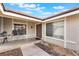 Inviting front porch with seating area, offering a welcoming entrance to the home, framed by a well maintained landscape at 6320 Vicuna Dr, Las Vegas, NV 89146