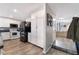 A well-lit kitchen featuring updated appliances, ample cabinet space, and wood-look flooring at 6320 Vicuna Dr, Las Vegas, NV 89146