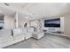 A cozy living room with a large television, stylish shelving, and comfortable sectional seating at 6320 Vicuna Dr, Las Vegas, NV 89146