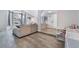 Open-concept living space with hardwood floors, providing seamless flow and ample room to relax and work at 6320 Vicuna Dr, Las Vegas, NV 89146