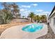 Gorgeous pool surrounded by lush landscaping and a secure fence at 6320 Vicuna Dr, Las Vegas, NV 89146