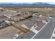 Aerial view of a desert community featuring single-Gathering homes and mountain views at 672 Lampshire Ln, Pahrump, NV 89060
