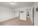 Spacious bedroom with sliding mirror closet doors and neutral carpet at 672 Lampshire Ln, Pahrump, NV 89060