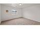 Neutral bedroom featuring a window bringing in natural light and a neutral carpet at 672 Lampshire Ln, Pahrump, NV 89060