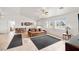 Bright living space featuring neutral walls, a comfortable sofa, and large windows offering natural light at 672 Lampshire Ln, Pahrump, NV 89060