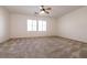 Large bedroom with ceiling fan and windows providing natural light at 7936 Dexter Falls St, Las Vegas, NV 89149