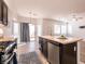 Kitchen featuring stainless steel appliances and an island with a sink at 7936 Dexter Falls St, Las Vegas, NV 89149