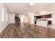 Spacious living room flows into the kitchen, featuring laminate flooring and natural light at 7936 Dexter Falls St, Las Vegas, NV 89149