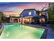Stunning backyard features a pool with a waterfall and an impressive exterior at 872 Timber Walk Dr, Henderson, NV 89052
