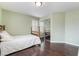 Inviting bedroom featuring a bed, wood floors, and a closet at 872 Timber Walk Dr, Henderson, NV 89052