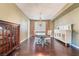 Traditional dining room with hardwood floors, chandelier, and bright windows at 872 Timber Walk Dr, Henderson, NV 89052