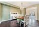 Formal dining room with hardwood floors, a stylish chandelier, and an antique sideboard at 872 Timber Walk Dr, Henderson, NV 89052