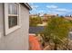 Charming home exterior showcasing pathway, well-manicured landscaping, and tree-lined street at 872 Timber Walk Dr, Henderson, NV 89052