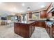 Kitchen featuring granite countertops, an island, stainless appliances and backyard view at 872 Timber Walk Dr, Henderson, NV 89052