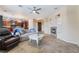 Cozy living room featuring a fireplace, tile floors, and access to kitchen at 872 Timber Walk Dr, Henderson, NV 89052