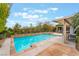 Inviting pool area featuring a spa and covered patio, perfect for relaxation and entertaining at 872 Timber Walk Dr, Henderson, NV 89052