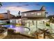 Spacious backyard showcasing a sparkling pool, covered patio, and lush greenery, perfect for outdoor entertaining at 9417 Churchill Downs Dr, Las Vegas, NV 89117