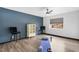 Versatile space perfect for a bedroom or fitness area with a yoga mat, weights, and natural light at 9417 Churchill Downs Dr, Las Vegas, NV 89117