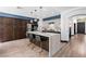 Modern kitchen offers stainless appliances, a breakfast bar, and a combination of dark wood and light cabinetry at 9417 Churchill Downs Dr, Las Vegas, NV 89117