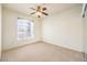 Neutral bedroom with large window and a ceiling fan offering plenty of natural light at 104 Breezy Tree Ct # 201, Las Vegas, NV 89145