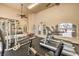Fitness center featuring treadmills, stationary bikes, weight machines, and ample space for exercise at 104 Breezy Tree Ct # 201, Las Vegas, NV 89145