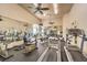 Fully equipped gym featuring cardio machines, weight training equipment, ceiling fans and mirrored walls at 104 Breezy Tree Ct # 201, Las Vegas, NV 89145