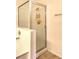 Close-up of a tiled shower with glass door and chrome fixtures at 104 Breezy Tree Ct # 201, Las Vegas, NV 89145