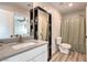 Bathroom with vanity and storage space, plus shower with curtain at 1115 Brilliant Meadow Ave, North Las Vegas, NV 89086
