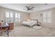 Inviting bedroom with a ceiling fan, plantation shutters, and a cozy, relaxing atmosphere at 1115 Brilliant Meadow Ave, North Las Vegas, NV 89086