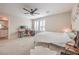 Spacious bedroom with natural light, desk, and ample space for relaxation at 1115 Brilliant Meadow Ave, North Las Vegas, NV 89086