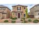 Two-story home with stone accents, desert landscaping, and a brick walkway at 1115 Brilliant Meadow Ave, North Las Vegas, NV 89086