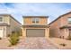 Inviting two-story home with a paver driveway and a two-car garage at 1115 Brilliant Meadow Ave, North Las Vegas, NV 89086