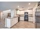 Bright kitchen with stainless steel appliances, white cabinets, and modern finishes, perfect for cooking at 1115 Brilliant Meadow Ave, North Las Vegas, NV 89086