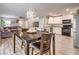 Open-concept kitchen featuring stainless steel appliances and a dining area, great for entertaining at 1115 Brilliant Meadow Ave, North Las Vegas, NV 89086