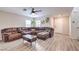 Spacious living room with wood floors, comfortable seating, and natural light at 1115 Brilliant Meadow Ave, North Las Vegas, NV 89086