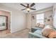 Cozy living room featuring neutral carpet, large window, and comfortable seating at 1115 Brilliant Meadow Ave, North Las Vegas, NV 89086