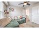 Inviting carpeted living room with comfortable seating and ample natural light at 1115 Brilliant Meadow Ave, North Las Vegas, NV 89086