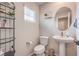 Chic powder room featuring modern fixtures, stylish mirror, and compact design at 1115 Brilliant Meadow Ave, North Las Vegas, NV 89086