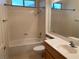 Bathroom with shower over tub and a vanity, offering a functional and well-lit space at 1654 Danbury Crossing Dr, Henderson, NV 89052