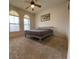 Cozy bedroom with carpet, a ceiling fan, natural light, and a minimalist aesthetic at 1654 Danbury Crossing Dr, Henderson, NV 89052