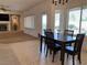 Bright dining area features tile flooring, a dining table with seating, and natural light from large windows at 1654 Danbury Crossing Dr, Henderson, NV 89052