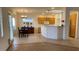 Charming dining area with wood table and tiled flooring, adjacent to the kitchen and living spaces at 1654 Danbury Crossing Dr, Henderson, NV 89052