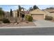 Charming single-story home with desert landscaping, a two-car garage and inviting curb appeal at 1654 Danbury Crossing Dr, Henderson, NV 89052