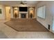 Spacious living room with a fireplace and tiled floors, perfect for entertaining or relaxing at 1654 Danbury Crossing Dr, Henderson, NV 89052
